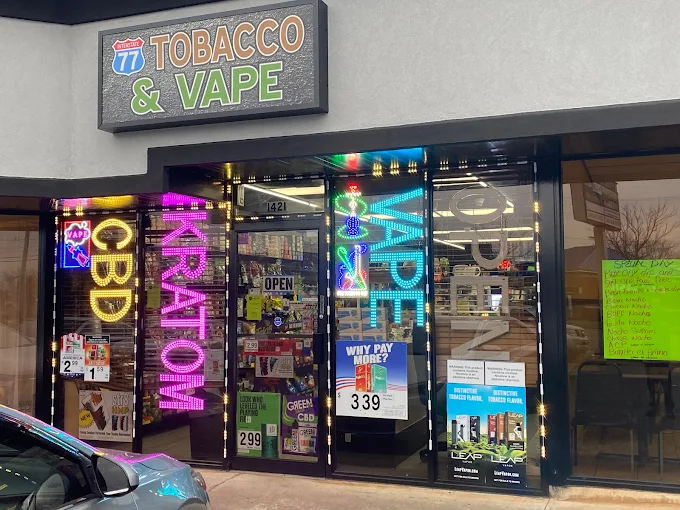 77 Tobacco & More Logo